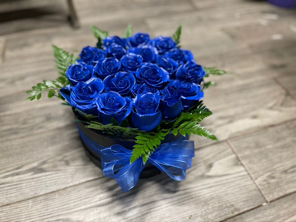 Caja redonda de rosas azules chica.