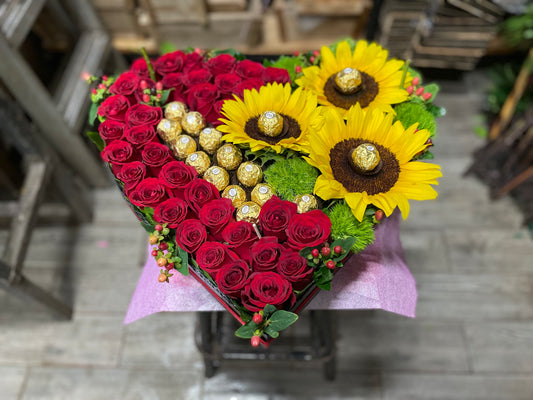Corazon de rosas y ferrero.