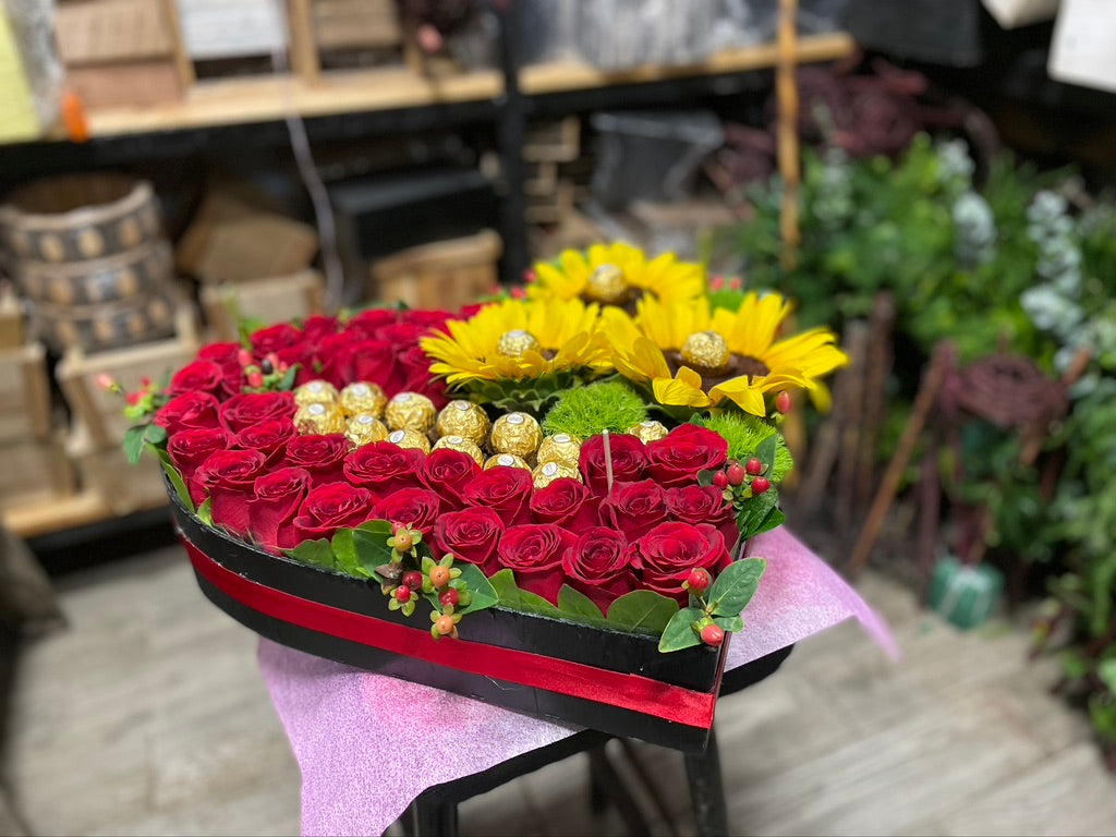 Corazon de rosas y ferrero.